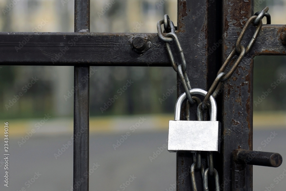 Gate Is Locked With Chain And Padlock Rusted Lock On A Metal Chain